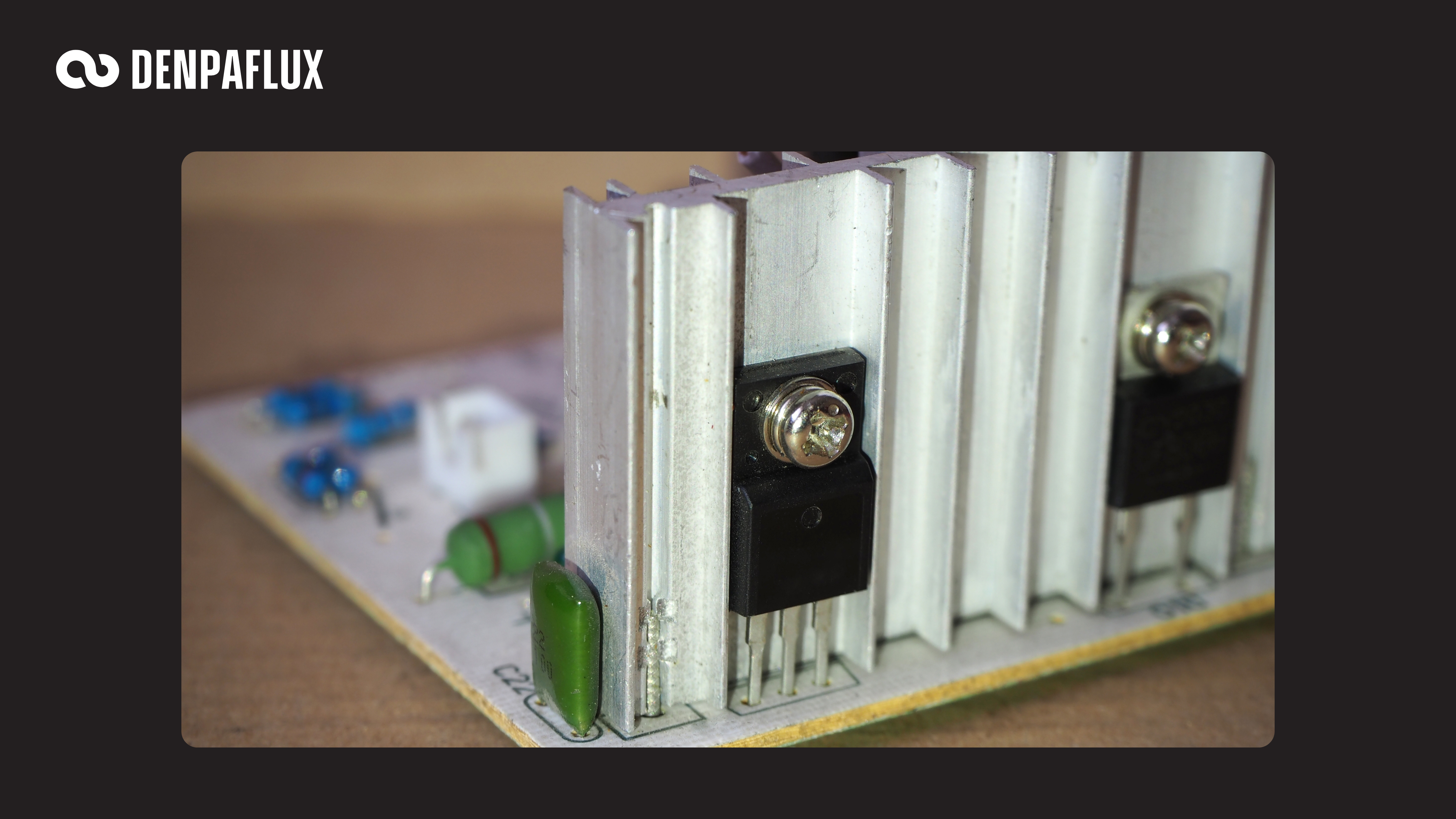 TO-package transistors screw-mounted to an aluminium heatsink on a through-hole PCB