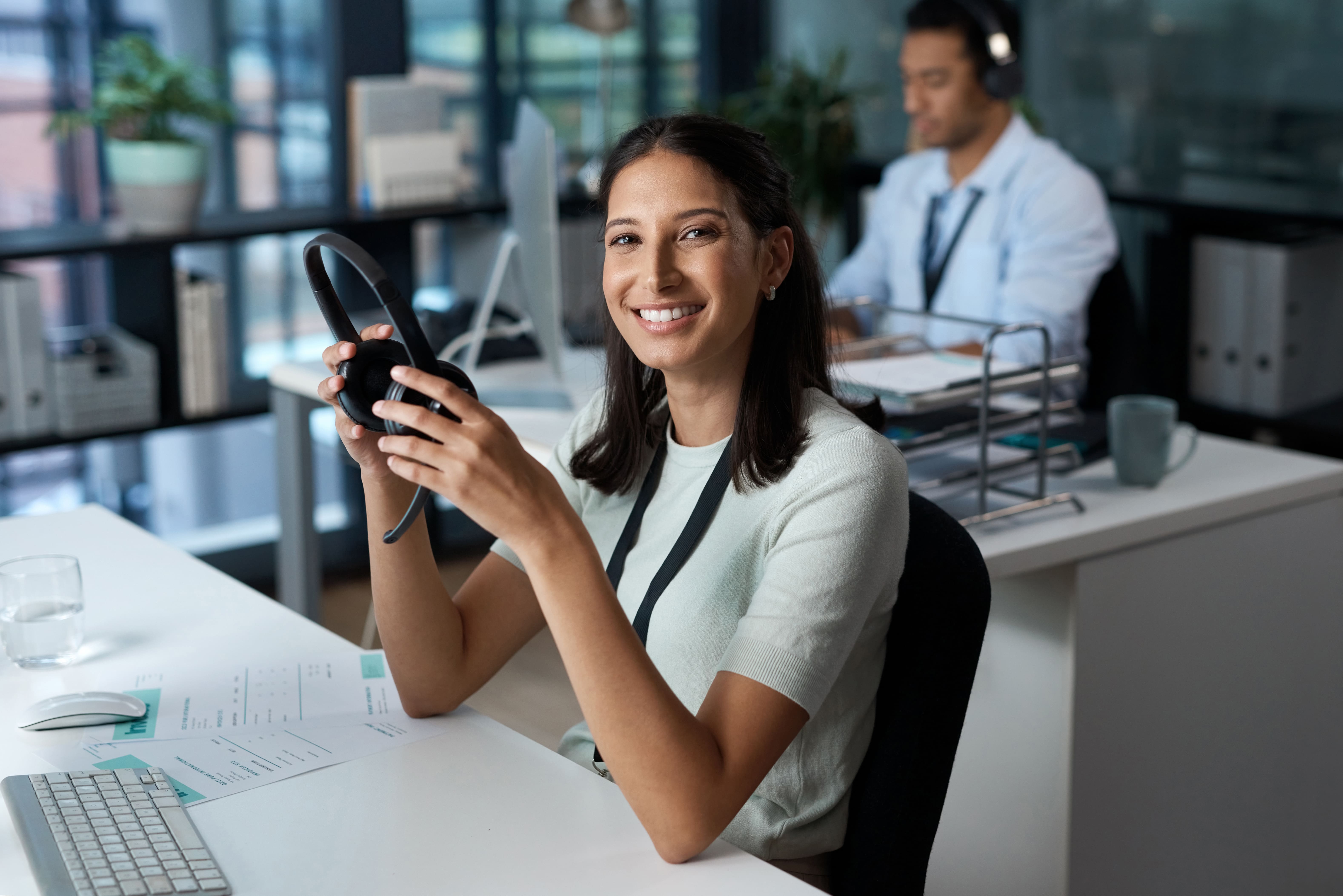 portrait-of-a-young-woman-using-a-headset-and-comp-2023-11-27-05-21-45-utc-min